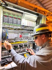 Wooden blocks aligned to spell 'CHECK' with a checkmark symbol on a neutral background.